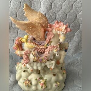 Vintage horse carousel, multi color, plays music 9 1/2” x 6 1/2” x 6 1/2”.